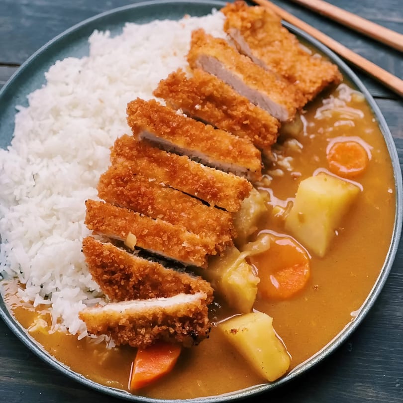 Donburiya Cafe's Japanese curry with crispy tonkatsu, white rice, carrots, and potatoes.